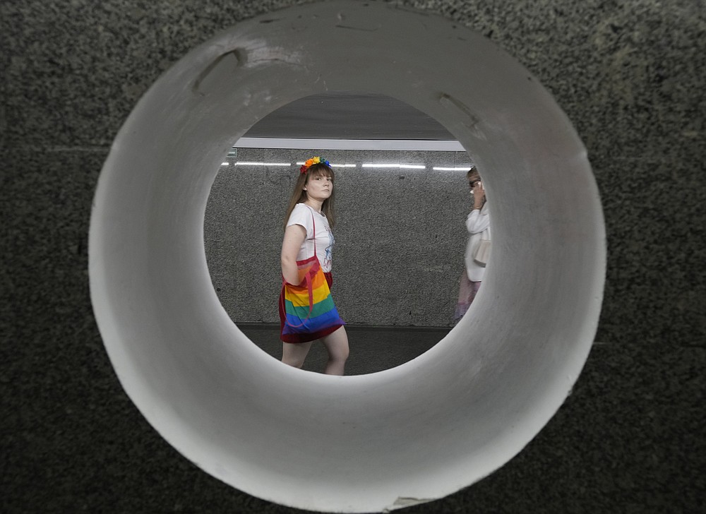 People walk towards the starting point of the Equality Parade, an LGBT pride parade, in Warsaw, Poland, Saturday, June 19, 2021.(AP Photo/Czarek Sokolowski)