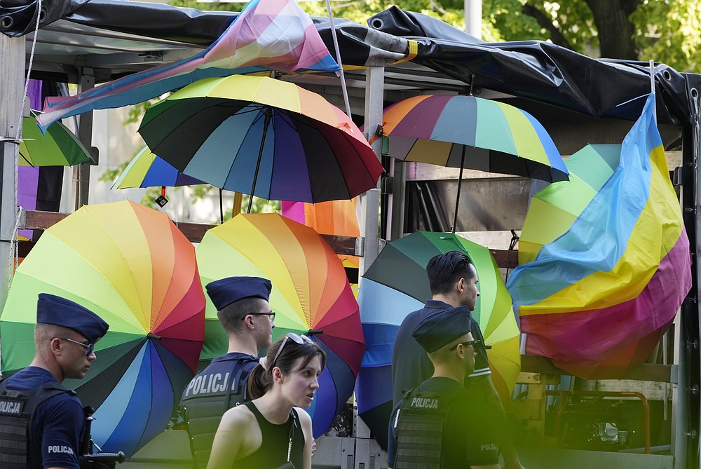 People take part in the Equality Parade, the largest gay pride parade in central and eastern Europe, in Warsaw, Poland, on Saturday June 19, 2021. The event has returned this year after a pandemic-induced break last year and amid a backlash in Poland and Hungary against LGBT rights. (AP Photo/Czarek Sokolowski)