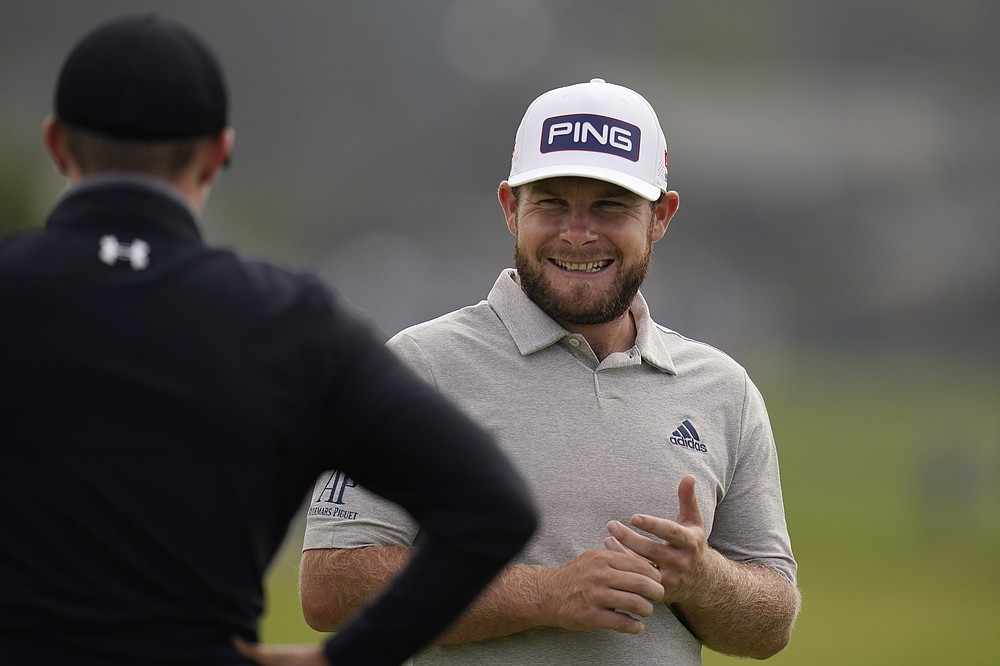 Tyrrell Hatton, right, laughs with Matt Fitzpatrick, of England, on the first green during the first round of the U.S. Open Golf Championship, Thursday, June 17, 2021, at Torrey Pines Golf Course in San Diego. (AP Photo/Gregory Bull)