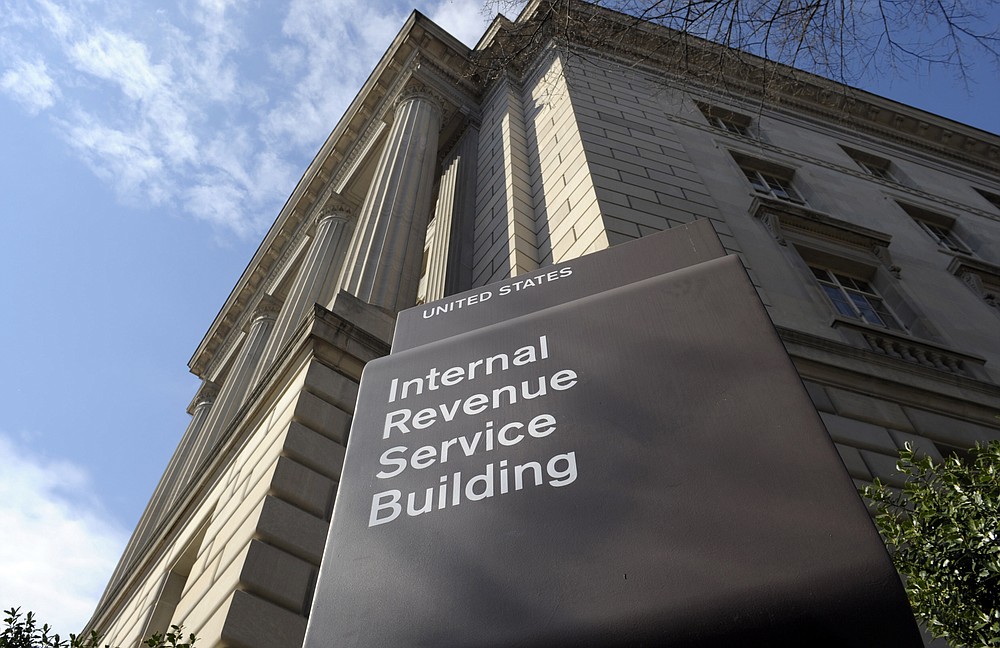 FILE - In this photo March 22, 2013, file photo, the exterior of the Internal Revenue Service (IRS) building in Washington. As ransomware attacks surge, the FBI is doubling down on its guidance to affected businesses: Don't pay the cybercriminals. But the U.S. government also offers a little-noticed incentive for those who do pay: The ransoms may be tax deductible. (AP Photo/Susan Walsh, File)