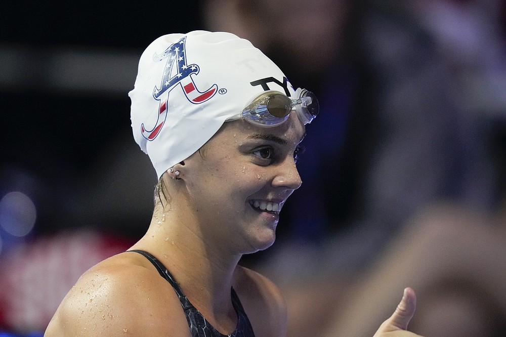 Rhyan White reacts after winning the women's 200 backstroke during wave 2 of the U.S. Olympic Swim Trials on Saturday, June 19, 2021, in Omaha, Neb. (AP Photo/Charlie Neibergall)