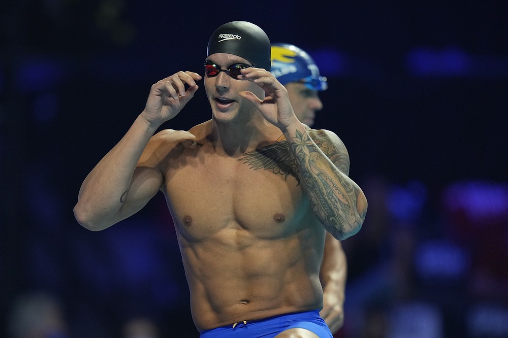 Caeleb Dressel gets ready for the men's 100 butterfly during wave 2 of the U.S. Olympic Swim Trials on Saturday, June 19, 2021, in Omaha, Neb. (AP Photo/Jeff Roberson)