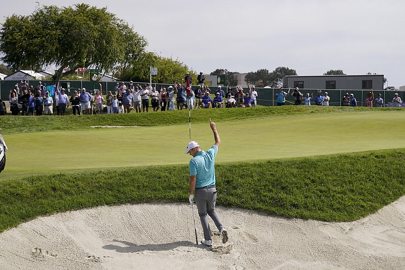 Russell Henley reacts after making his birdie shot from the bunker on the 11th green Saturday during the third round of the U.S. Open Golf Championship at Torrey Pines Golf Course in San Diego. - Photo by Jae C. Hong of The Associated Press