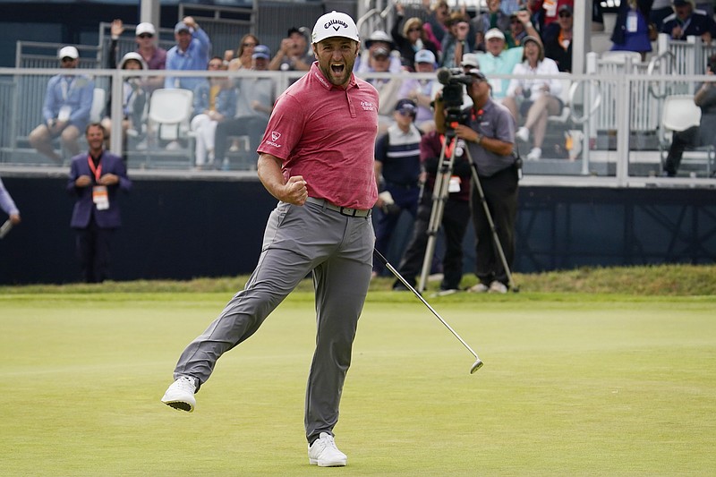 Jon Rahm, of Spain, reacts to making his birdie putt on the 18th green during the final round of the U.S. Open Golf Championship, Sunday, June 20, 2021, at Torrey Pines Golf Course in San Diego. (AP Photo/Gregory Bull)