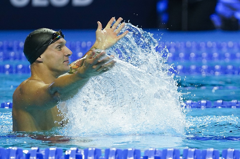 Caeleb Dressel reacts after winning the men's 50 freestyle during wave 2 of the U.S. Olympic Swim Trials on Sunday, June 20, 2021, in Omaha, Neb. (AP Photo/Jeff Roberson)