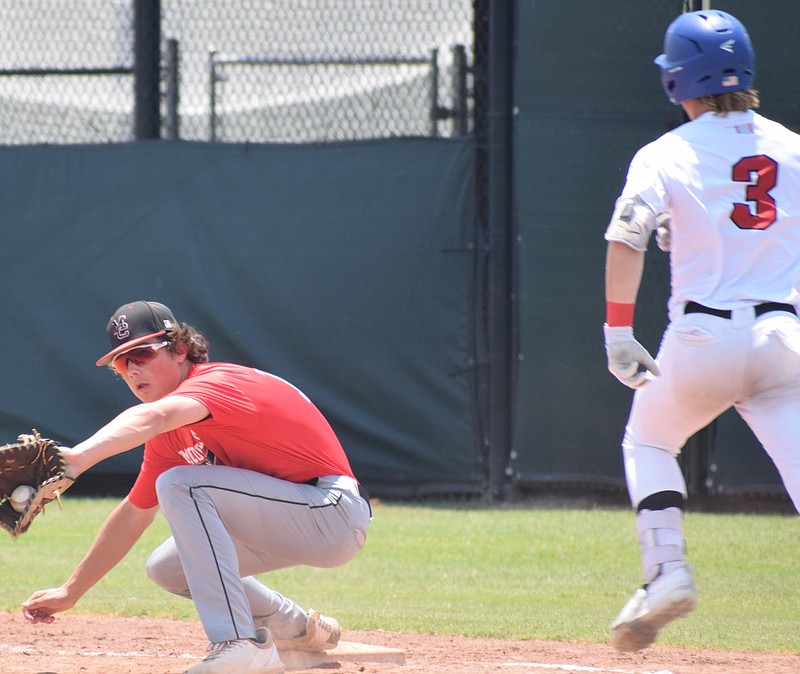 RICK PECK/SPECIAL TO MCDONALD COUNTY PRESS McDonald County first baseman Colton Ruddick takes a throw to get a Tulsa Titan runner out during the McDonald County 16U baseball team's 3-0  loss on June 17 in the Chad Wolff Classic at the Randall Tyson Sports Complex in Springdale.