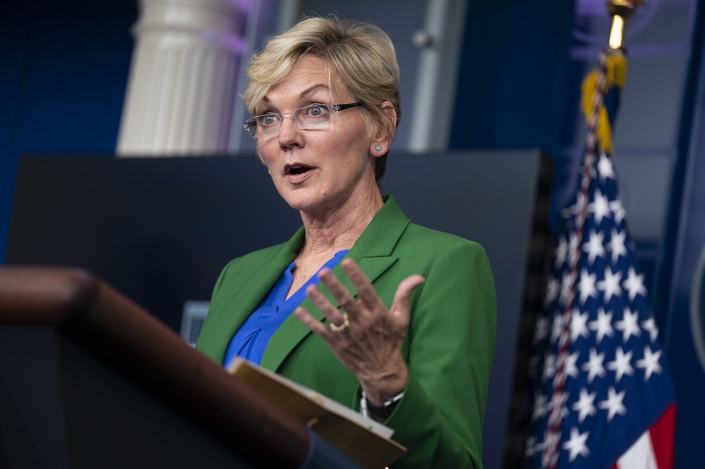 FILE - In this May 11, 2021 file photo Energy Secretary Jennifer Granholm speaks during a press briefing at the White House in Washington. The damned-if-you-pay-damned-if-you-don’t dilemma on ransomware payments has left U.S. officials fumbling about how to respond. While the Biden administration “strongly discourages” paying, it recognizes that failing to pay would be suicidal for some victims. Granholm said this month that she is in favor of banning payments. ”But I don’t know whether Congress or the president is.”  (AP Photo/Evan Vucci, File)