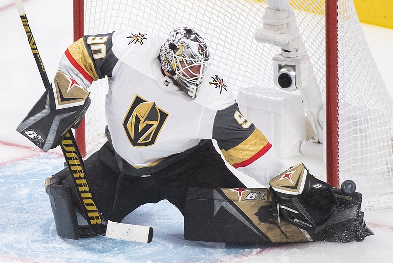 Vegas Golden Knights goaltender Robin Lehner makes a save against the Montreal Canadiens during the third period of Game 4 in an NHL Stanley Cup playoff hockey semifinal in Montreal, Sunday, June 20, 2021. (Graham Hughes/The Canadian Press via AP)