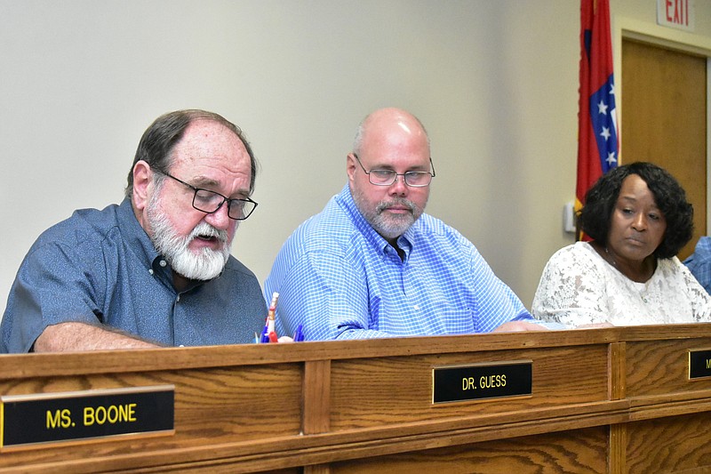 From left, Watson Chapel School District Superintendent Jerry Guess discusses an audit report as school board President Kevin Moore and board member Goldie Whitaker listen Monday, June 21, 2021. (Pine Bluff Commercial/I.C. Murrell)