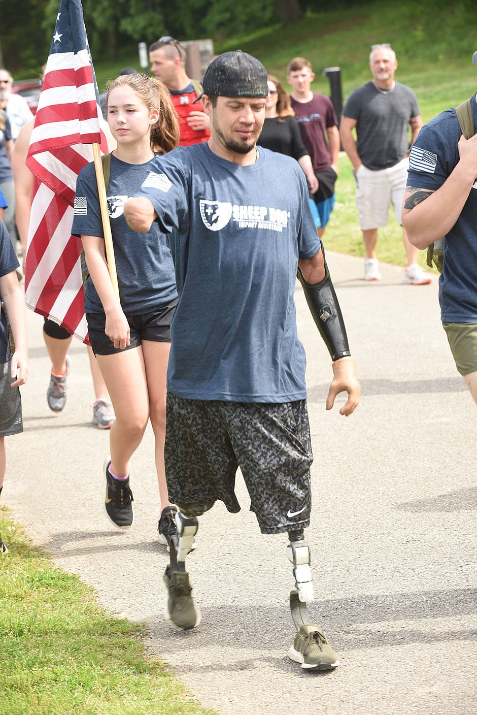 WALK REMEMBERS VETERANS
Todd Nicely, a Marine Corps veteran, walks on Saturday May 23 2020 during the Carry the Load walk at Lake Bella Vista. Sheep Dog Impact Assitance, based in Rogers, held the walk to remember fallen veterans on Memorial Day weekend. Carry the Load is a national effort to bring all Amercans and veterans groups together to honor veterans each day. Sheep Dog Impact Assistance members normally place flags on the graves of veterans at the Fayetteville National Cemetery, but the U.S. Department of Veterans Affairs has ordered that no flag placements or public ceremonies are to be held at any national cemetery over Memorial Day this year. The walk was an alternative remembrance, said Kay Ricker with Sheep Dog Impact Assistance. The group has chapters in several states, Ricker said. Many of the 50 or so walkers carried flags and wore backpacks emblazoned with the names of veterans. Go to nwaonline.com/200524Daily/ to see more photos.
(NWA Democrat-Gazette/Flip Putthoff)