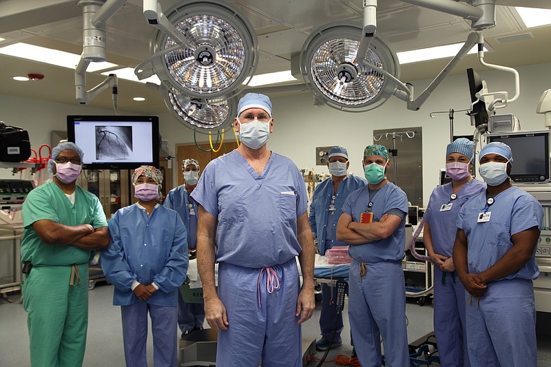 Cardiovascular and thoracic surgeon Dr. Daniel McCoy stands with a team in the new National Park Medical Center cardiovascular surgery suite. - Submitted photo