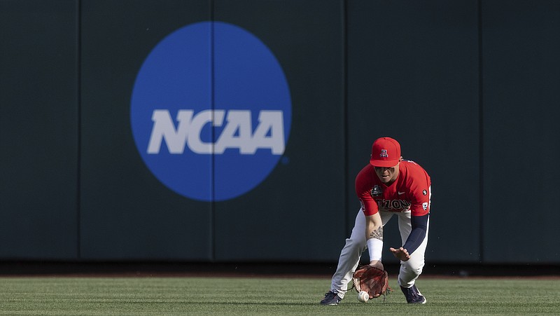 Arizona's Ryan Holgate fields a hit by Vanderbilt's Dominic Keegan during the first inning of a baseball game in the NCAA College World Series on Saturday, June 19, 2021, in Omaha, Neb. (AP Photo/Rebecca S. Gratz)