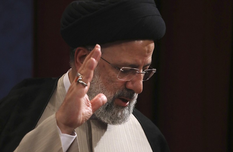 In this June 21, 2021, photo, Iran's new President-elect Ebrahim Raisi waves at the conclusion of his news conference in Tehran, Iran. Biden administration officials are insisting that the election of a hard-liner as Iran’s president won’t affect prospects for reviving the faltering 2015 nuclear deal with Tehran. But there are already signs that their goal of locking in a deal just got harder. (AP Photo/Vahid Salemi)