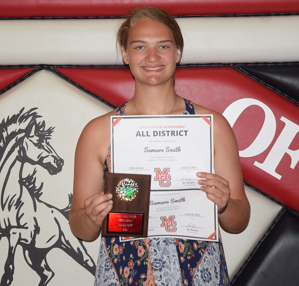 RICK PECK/SPECIAL TO MCDONALD COUNTY PRESS
McDonald County High School athletic director Bo Bergen presented team awards for the 2021 girls' soccer season at an athletic banquet held on June 22 at MCHS. Samara Smith, Defensive Player of the Year. Not present: Kadence Elliott, Player of the Year; Anna Clarkson, Offensive Player of the Year; Yarecci Quintero, Varsity Character Award; and, Erika Medina, Junior Varsity Character Award.