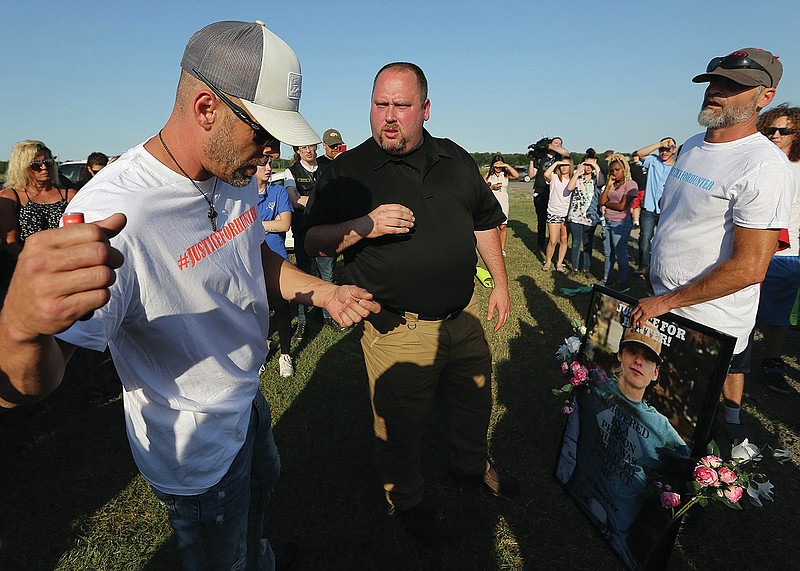 Lonoke County Sheriff John Staley (center) talks with the uncles of Hunter Brittain, Jesse Brittain (left) and Harley Brittain (right), during a rally outside the Lonoke County sheriff's office on Wednesday, June 23, 2021, in Lonoke. Hunter Brittain was shot by a Lonoke County sheriff's deputy during a traffic stop earlier that morning. More photos at arkansasonline.com/624lonoke/
(Arkansas Democrat-Gazette/Thomas Metthe)