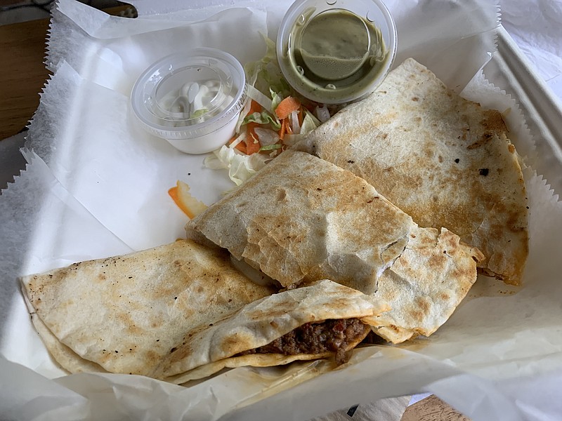 The Quesadilla al Pastor from Casa Manana Taqueria in the River Market Ottenheimer Market Hall was orange-oily but delicious. (Arkansas Democrat-Gazette/Eric E. Harrison)