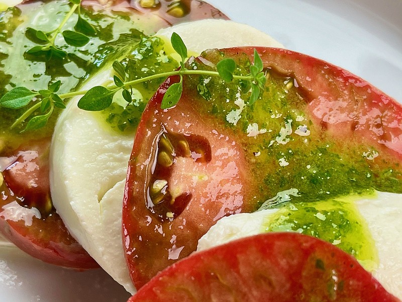 Basil Vinaigrette stands in for the fresh basil leaves in this Easy Caprese salad. (Arkansas Democrat-Gazette/Kelly Brant)