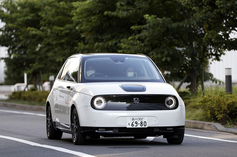 A Honda Motor Co. e electric vehicle is driven during a test drive in Tokyo on June 17, 2021. MUST CREDIT: Bloomberg photo by Kiyoshi Ota.