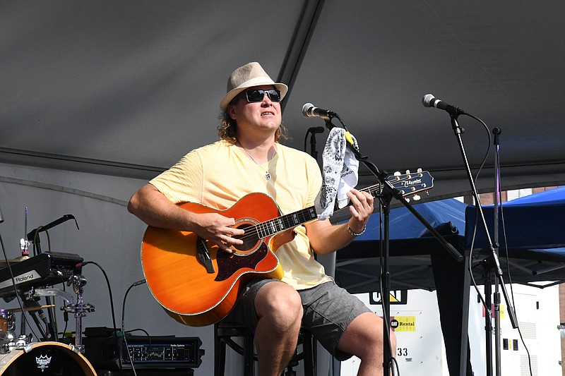 John Calvin Brewer opens the final installment of the first run of Bridge Street LIVE!. The concert series will return in September. - Photo by Tanner Newton of The Sentinel-Record