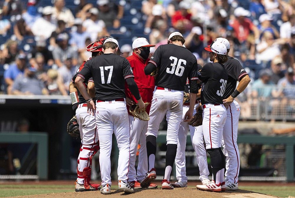 North Carolina State players meet on the mound around starting pitcher Garrett Payne (36) in the fourth inning against Vanderbilt during a baseball game in the College World Series, Friday, June 25, 2021, at TD Ameritrade Park in Omaha, Neb. (AP Photo/Rebecca S. Gratz)