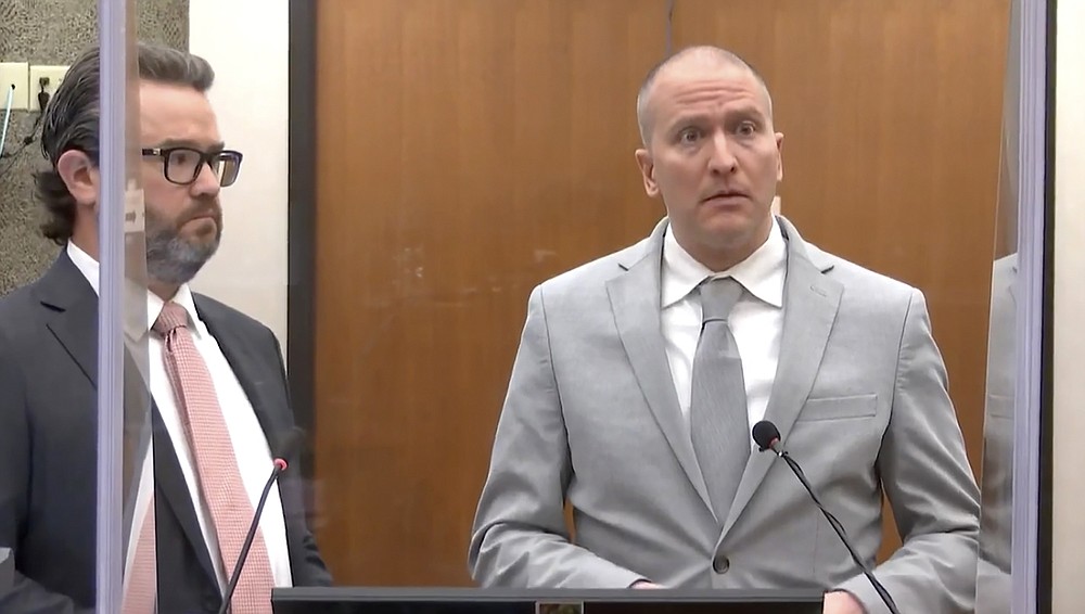 In this image taken from video, former Minneapolis police Officer Derek Chauvin, right, accompanied by defense attorney Eric Nelson, addresses the court as Hennepin County Judge Peter Cahill presides over Chauvin's sentencing, Friday, June 25, 2021, at the Hennepin County Courthouse in Minneapolis. Chauvin faces decades in prison for the May 2020 death of George Floyd.  (Court TV via AP, Pool)
