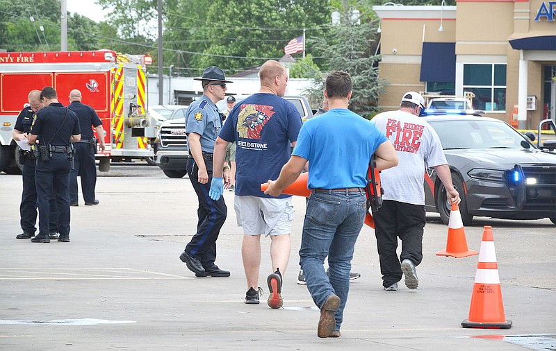 Police, deputies and emergency personnel cordoned off the White Oak station parking lot and surrounding area Saturday afternoon after a Pea Ridge Police officer was struck while on duty. The incident is being investigated by Benton County Sheriff's deputies.