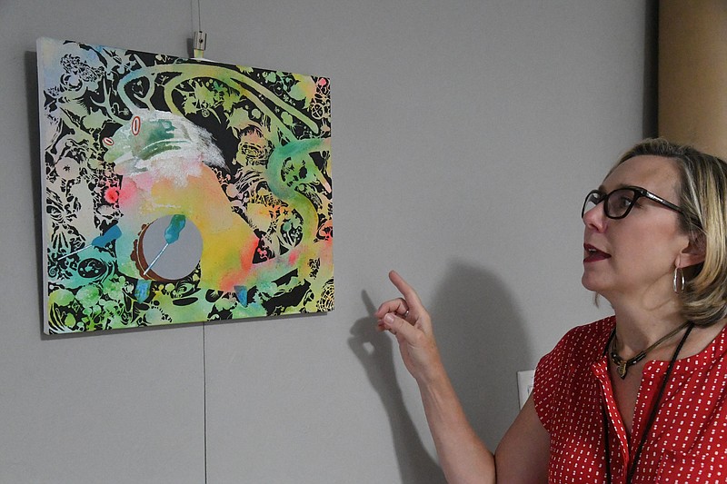 Mary Zunick, executive director of the Hot Springs Sister City Program, shows a painting of a Hanamaki deer dancer. She is hosting a virtual tour of Hanamaki this Wednesday. - Photo by Tanner Newton of The Sentinel-Record