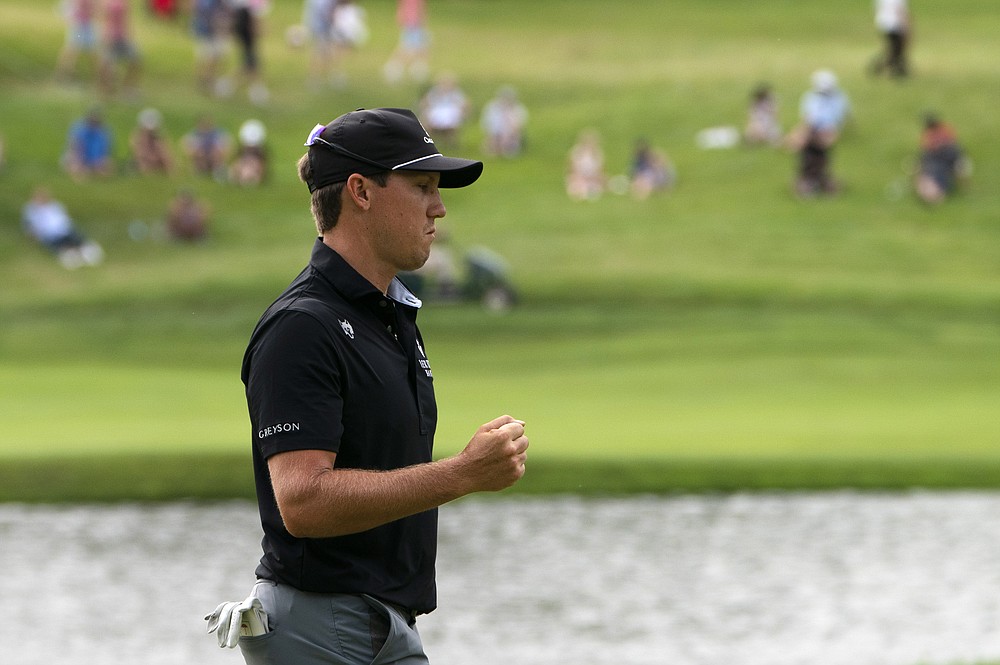 Kramer Hickok reacts after sinking a birdie putt on the 17th green during the third round of the Travelers Championship golf tournament at TPC River Highlands, Saturday, June 26, 2021, in Cromwell, Conn. (AP Photo/John Minchillo)