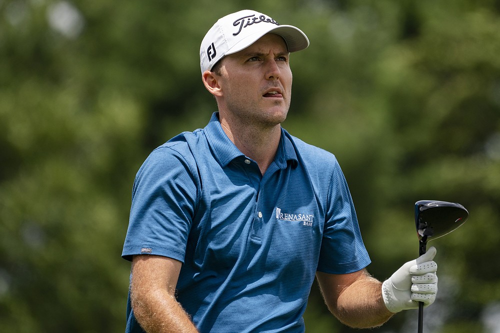 Russell Henley watches his shot off the first tee during the third round of the Travelers Championship golf tournament at TPC River Highlands, Saturday, June 26, 2021, in Cromwell, Conn. (AP Photo/John Minchillo)