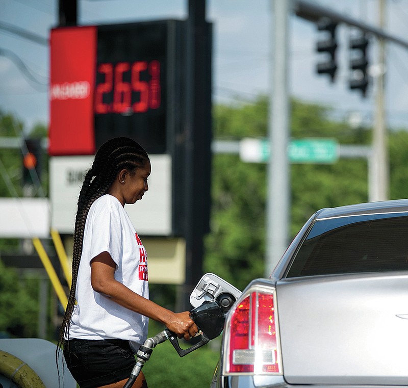 Lakisha Hardy fills up her tank at a gas station on the corner of 12th and Fair Park in Little Rock on Friday, June 25, 2021.

(Arkansas Democrat-Gazette/Stephen Swofford)