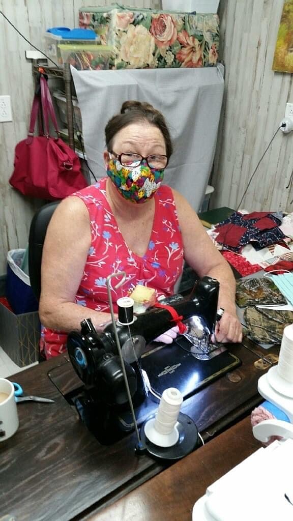 Dianna Winfree, a member of Heart-N-Hands Extension Homemakers Club, sews masks for the Covid-19 Face Mask Project. (Special to The Commercial)