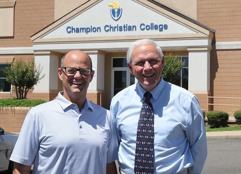 Champion Christian College President Eric Capaci, left, stands with Garland County Circuit Judge Ralph Ohm in front of the college on June 22. - Photo by Richard Rasmussen of The Sentinel-Record