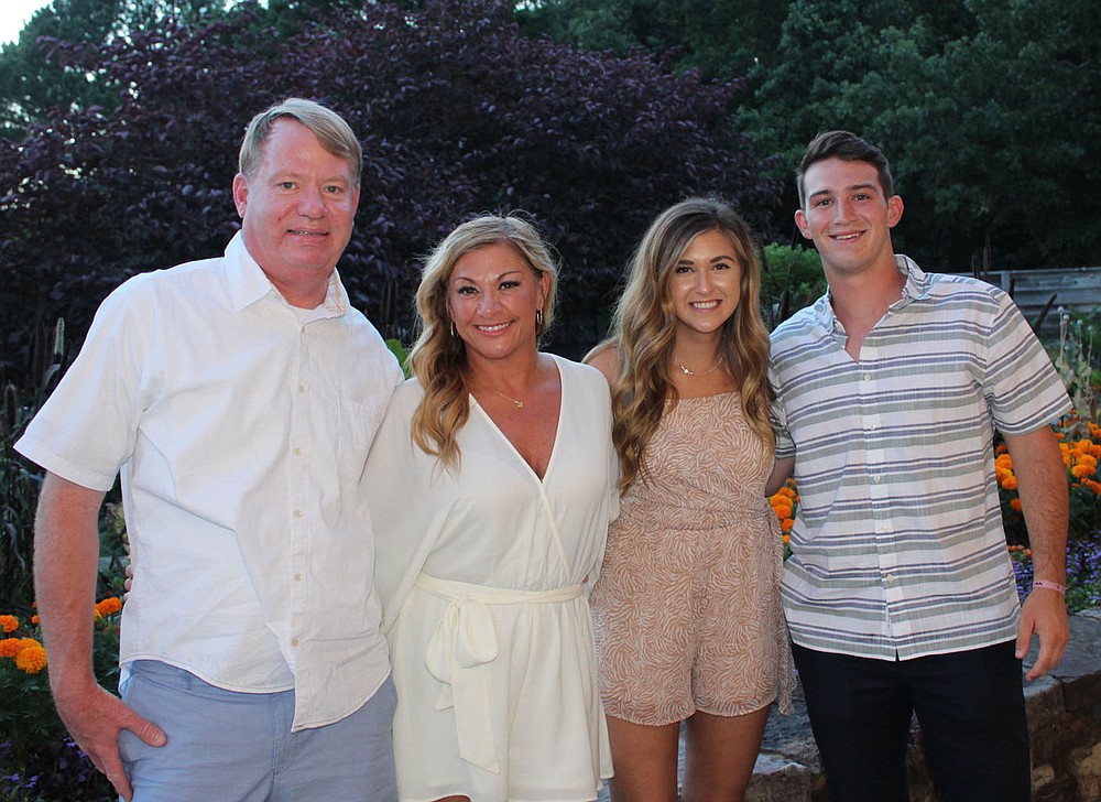 Clay and Juli McWhorter (from left) and Ashlyn Babbitt and Colin McWhorter gather at Red, White and Baby Blue.
(NWA Democrat-Gazette/Carin Schoppmeyer)