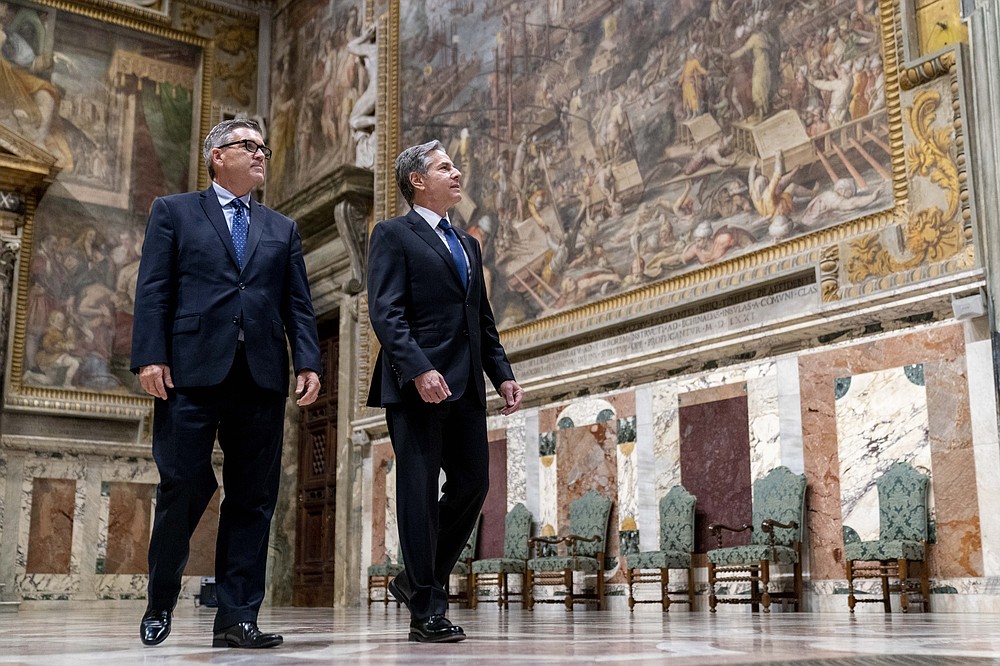 Secretary of State Antony Blinken, right, accompanied by U.S. Embassy charge d'affaires to the Holy See Patrick Connell, left, visits the Sala Regia at the Vatican in Rome on Monday June 28, 2021. Blinken is on a weeklong trip to Europe traveling to Germany, France and Italy.  (AP Photo / Andrew Harnik, Pool)