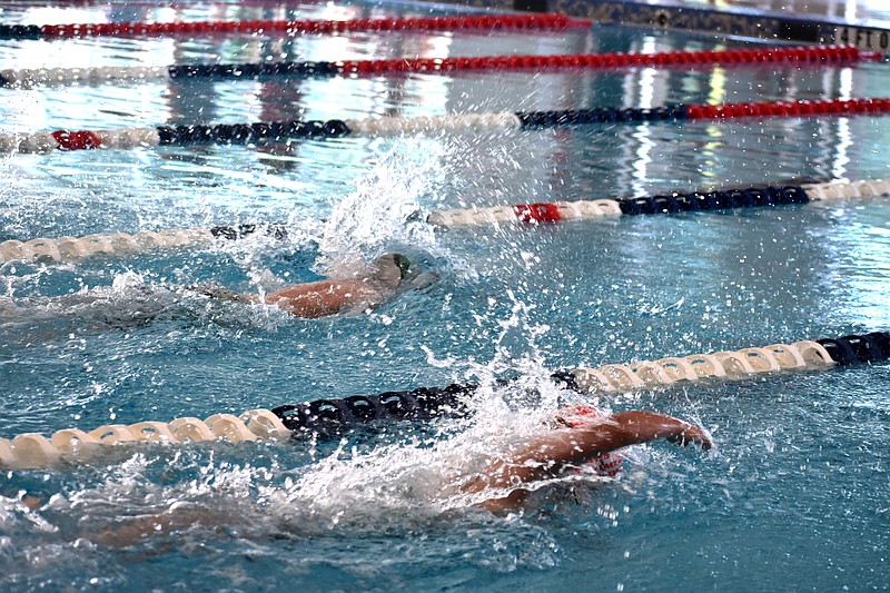 Swimmers compete in a 200-meter contest during the Arkansas AAU State Championships meet Friday, June 25, 2021, at the Pine Bluff Aquatics Center. (Pine Bluff Commercial/I.C. Murrell)