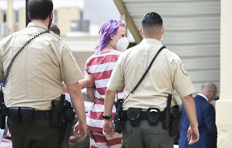 Officers escort Shawna Rhae Cash, Monday, June 28, 2021 at the Benton County Circuit Court in Bentonville. Check out nwaonline.com/210629Daily/ for today's photo gallery. 
(NWA Democrat-Gazette/Charlie Kaijo)