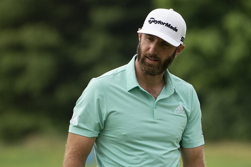 Dustin Johnson reacts to a missed put on the fourth green during the third round of the Travelers Championship golf tournament at TPC River Highlands, Saturday, June 26, 2021, in Cromwell, Conn. (AP Photo/John Minchillo)