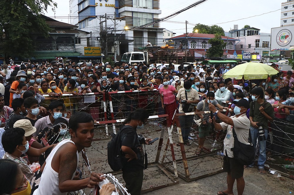 A crowd waits outside Insein Prison in Yangon, Myanmar Wednesday, June 30, 2021.  Myanmar's government began releasing about 2,300 prisoners on Wednesday, including activists who were detained for protesting against the military's seizure of power in February and journalists who reported on the protests, officials said. (AP Photo)