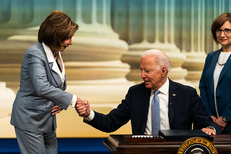 House Speaker Nancy Pelosi greets President Joe Biden on June 30, 2021, in the Eisenhower Executive Office Building in Washington, D.C. This year the federal government is projected to spend $6.8 trillion but take in only $3.8 trillion in revenue. Biden's $1.9 trillion stimulus, passed in March, accounts for much of this year's spending imbalance. MUST CREDIT: Washington Post photo by Demetrius Freeman