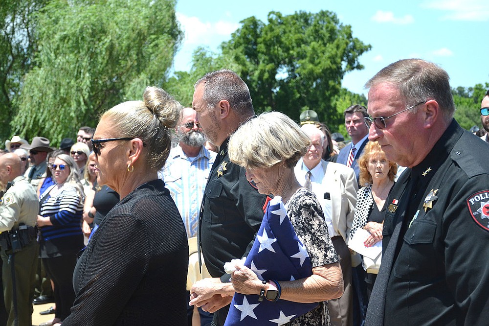 TIMES photograph by Annette Beard
Pea Ridge Police Sgt. John Hicks escorted Dalene Hart, mother of slain Pea Ridge Police Officer Kevin Apple from the funeral services Friday, along with Pea Ridge Police Chief Lynn Hahn and his wife, Tammy, left.