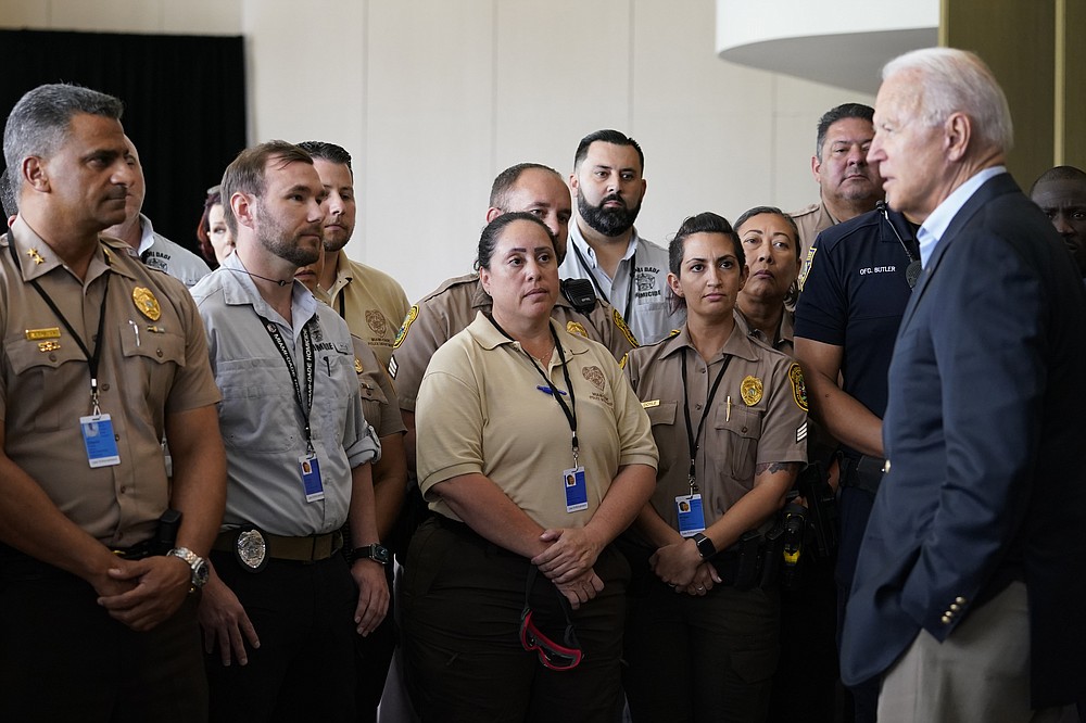 President Joe Biden meets with first responders in Miami Beach, Fla., Thursday, July 1, 2021, who were working on the condo tower that collapsed in Surfside, Fla., last week. (AP Photo/Susan Walsh)