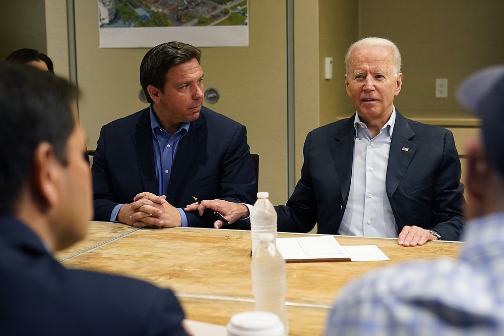 President Joe Biden attends a briefing in Miami Beach, Fla., with Florida Gov. Ron DeSantis, Thursday, July 1, 2021, on the collapsed condo tower in Surfside. (AP Photo/Susan Walsh)