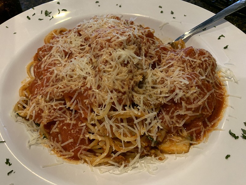 Spgahetti Works includes meatballs, sliced Italian sausage and mushrooms in a garlicky meat sauce over al dente pasta at Rivera Italian Restaurant on East McCain Boulevard in North Little Rock. (Arkansas Democrat-Gazette/Eric E. Harrison)