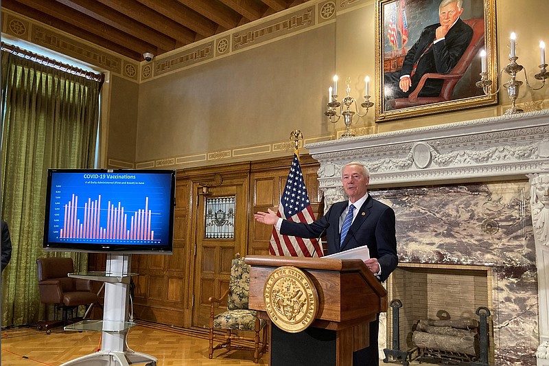 Arkansas Gov. Asa Hutchinson talks about COVID-19 vaccinations at the state Capitol in Little Rock, on Tuesday. Hutchinson, a Republican, has been in the national spotlight this year as he heads into the final half of his last term in office. - AP Photo/Andrew Demillo