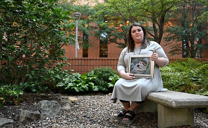 Ashton Reed holds a portrait of her daughter, Celia Ann Reed, in the Chancellor's Garden on the UAMS campus in Little Rock on Friday, July 2, 2021.
(Arkansas Democrat-Gazette/Stephen Swofford)