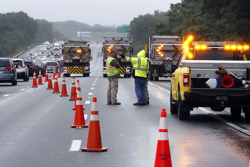 Traffic on Interstate 95 is diverted in the area of an hours long standoff with a group of armed men that partially shut down the highway, Saturday, July 3, 2021, in Wakefield, Mass. (AP Photo/Michael Dwyer)