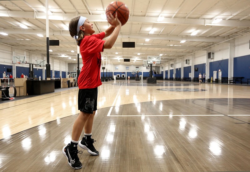 Walker Frame, 10, takes a shot Wednesday, June 30, 2021, as he participates in the Mike Wright Shooting Academy at the Springdale Recreation Center. Chad Wolf, director of Springdale's Parks and Recreation Department, reported last month that Springdale sports leagues have seen increased participation despite covid. Check out nwaonline.com/210704Daily/ and nwadg.com/photos for a photo gallery.
(NWA Democrat-Gazette/David Gottschalk)