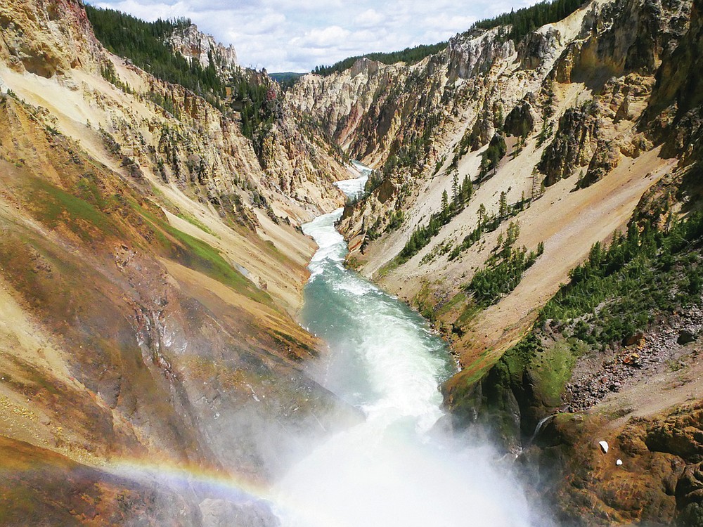 This June 17, 2017 image shows the Yellowstone River flowing through the Grand Canyon in Yellowstone National Park, Wyoming. The first episode of the Parks podcast highlights stories of Native American tribal members who live near the Yellowstone area (Matt Dahlseid/Santa Fe New Mexican via AP)
