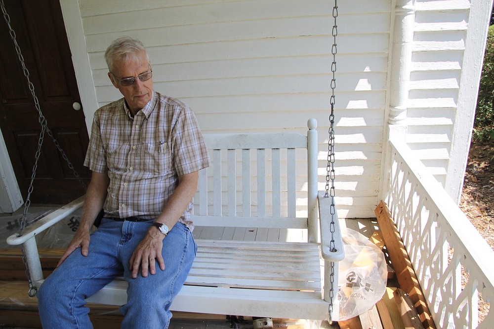 A swing is a pleasant thing to have on a porch. Realizing he didn’t have the ability to fix the house’s three porches, Shipman called in a contractor. Because the work on the house never ends, a porch is also a good place to store building materials.
