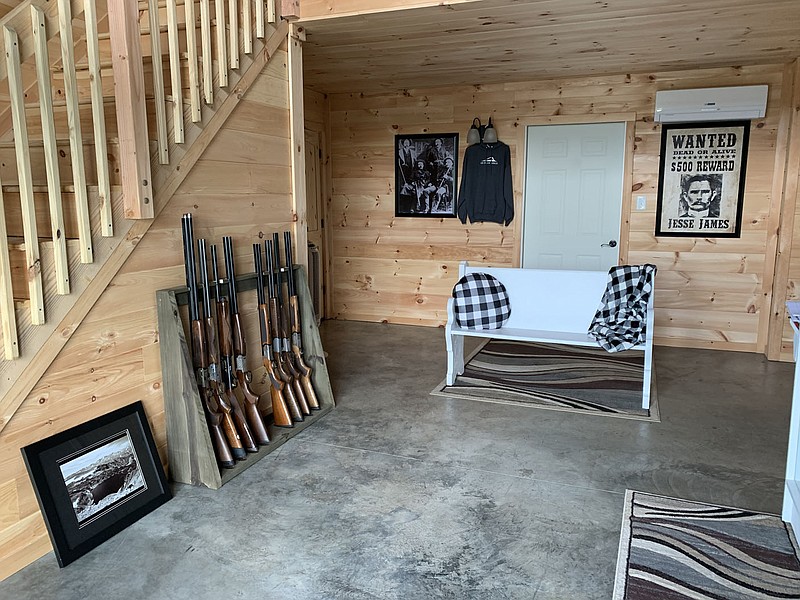 PHOTO BY ALEXUS UNDERWOOD. In The Outlaw Ridge lobby customers can check in, rent guns and ammunition, and purchase merchandise. On the wall of the lobby is a poster of Jesse James, which is the road the range is located on as well as inspiration for the business name.